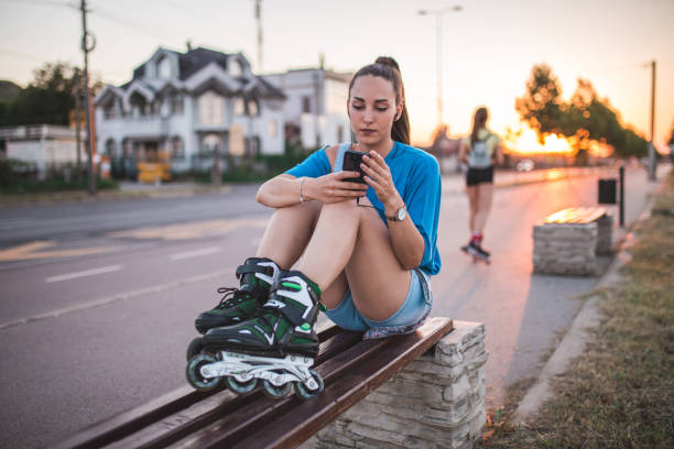 istock Sporty girl using phone 1292322449