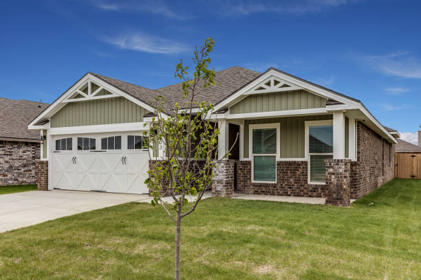istock Great cozy home with board and battin and brick exterior 1292325251