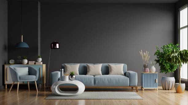 istock The interior has a sofa and armchair on empty dark wall background. 1292326197