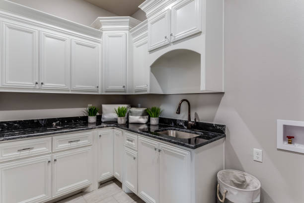 istock Utility room with an ample amount of cabinetry and counterspace 1292330311