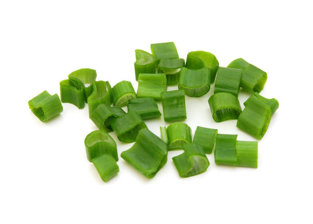 istock cut green onions on a white background 1292330895