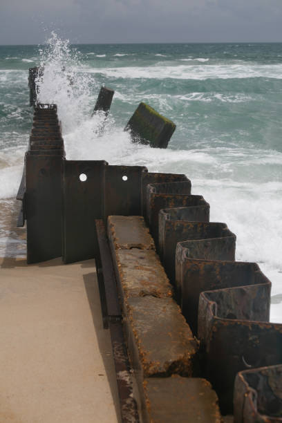 istock Seascape with an old steel breakwater 1292330937