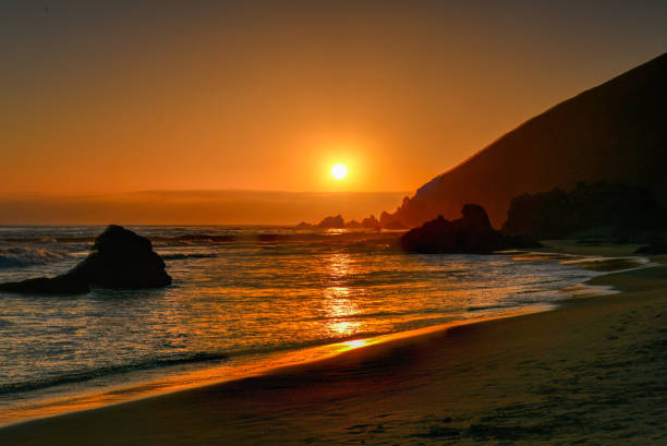 Tourism trip to Portugal, Porto, famous for the Capela do Senhora Pedra. Amazing cliff rocks on the Atlantic ocean west coast of Portugal in Alentejo region at sunset