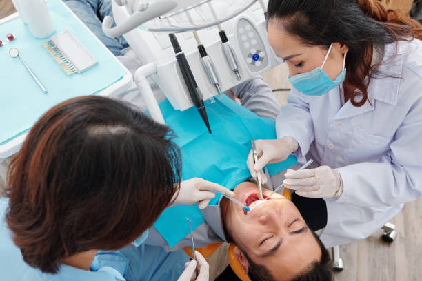 istock Treating teeth of patient 1292336188