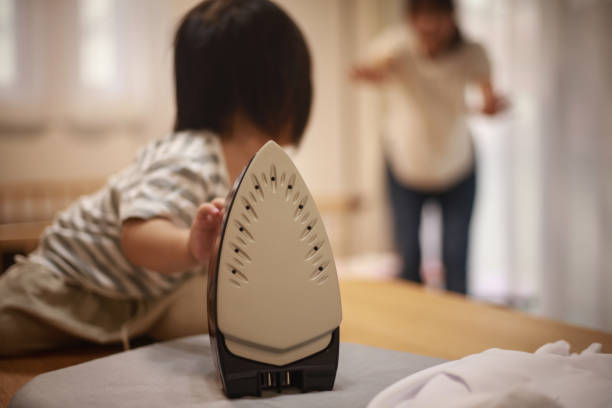Girl trying to touch the iron