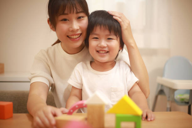 istock Parents and children playing with blocks 1292342935
