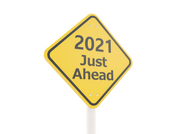 istock 2021 New year symbol on a road sign 1292343143