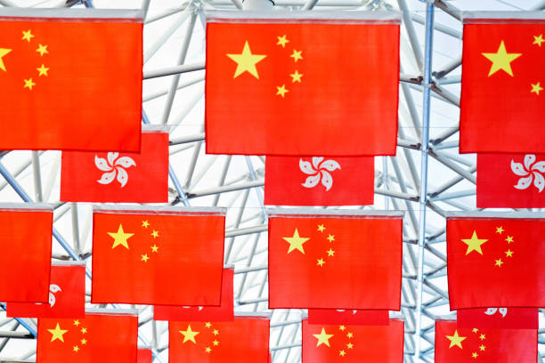 istock Chinese and Hong Kong Flags hanging on building ceiling 1292343736