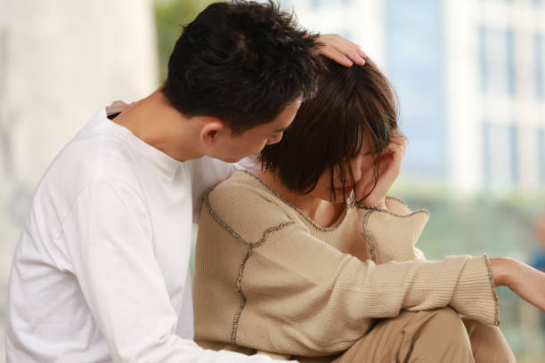 istock Men encouraging depressed women 1292344618