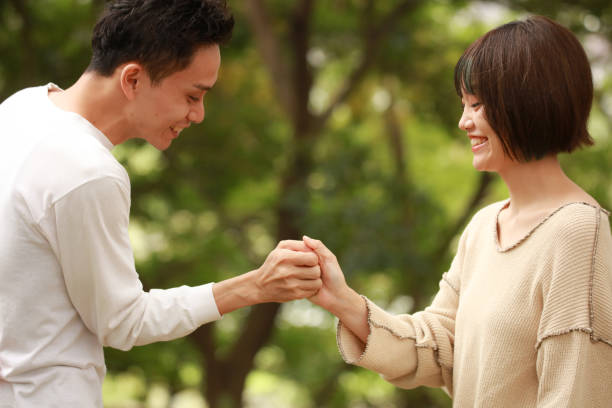 istock Thumb wrestling couple 1292344649