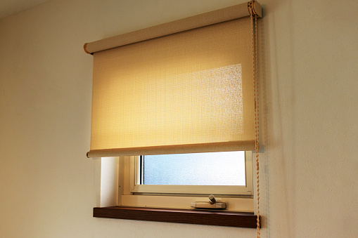 Small glass window with roll screen