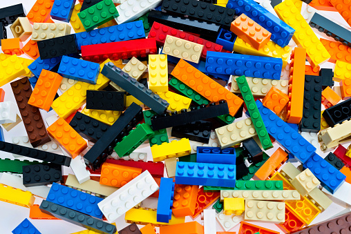 Heap of plastic block toy background.