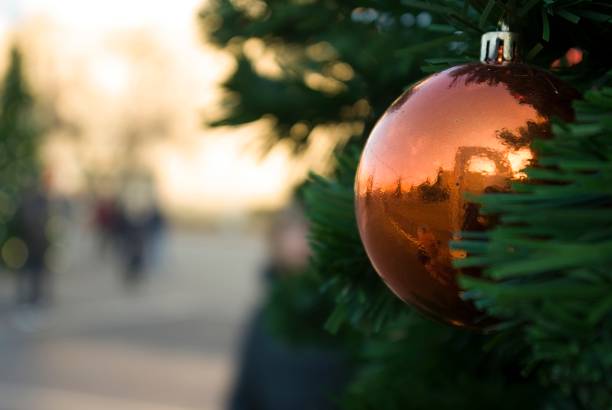 istock Christmas toy on an artificial Christmas tree in sunny weather 1292349559