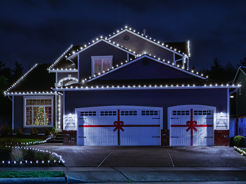 istock American suburban home exterior with festive Christmas lights 1292349603