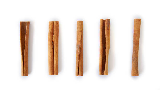 istock Close up cinnamon sticks isolated on white background 1292350514