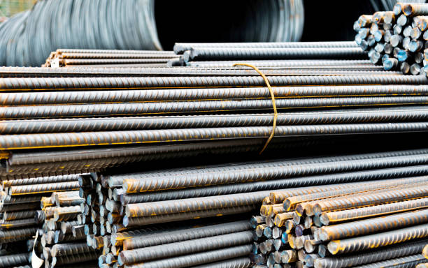 istock Steel wire rolls and steel bars on construction site 1292351093