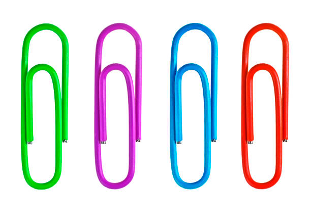 istock Set of colored paperclips on a white background 1292351110