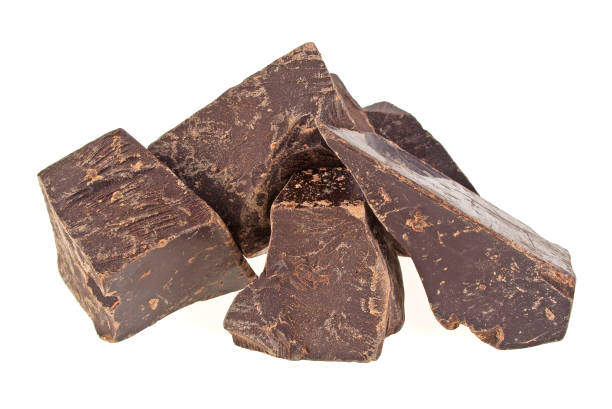 istock Chocolate pieces isolated on white background 1292351187