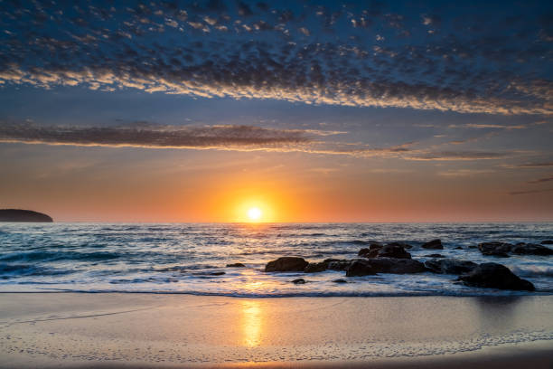 istock Beautiful sunrise with high cloud at the seaside 1292351263