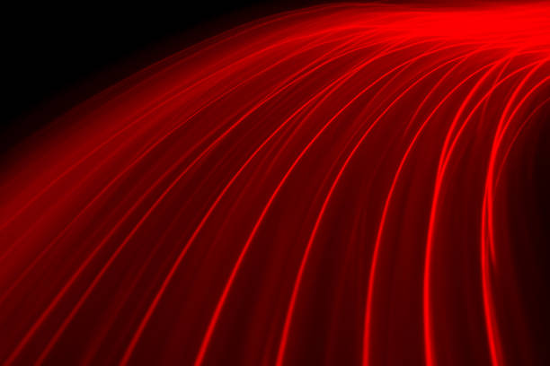istock Abstract image of lines in red color on black background 1292352536