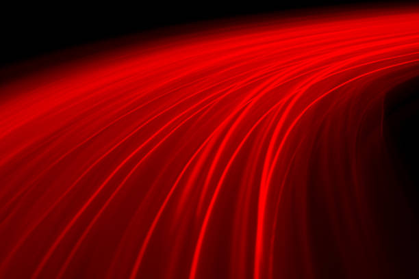 istock Abstract image of red lines on black background 1292352590