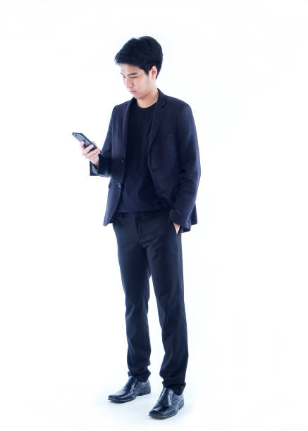 istock Young man with smartphone on white background 1292353854