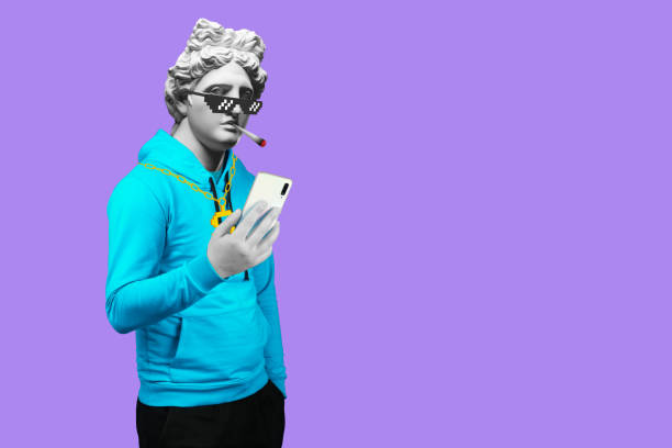 istock Modern art collage. Concept portrait of a man  holding mobile smartphone using app texting sms message. Gypsum head of of Apollo. Man in suit. On a blue background. 1292357685
