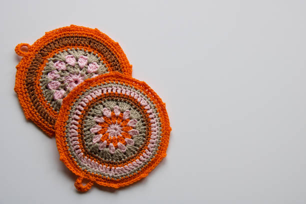 istock two handmade croketing pot holders in pink and orange color 1292360187