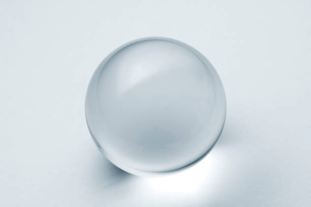 istock A lens ball in light blue. Glass ball with reflection in silver blue tone. 1292361159