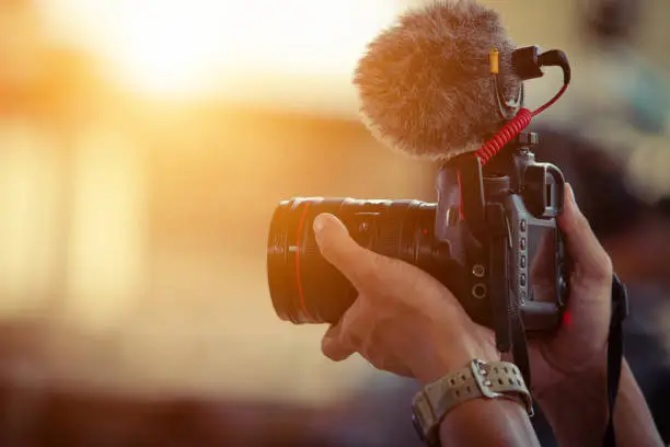 Blogger content creator camera handheld shooting video footage