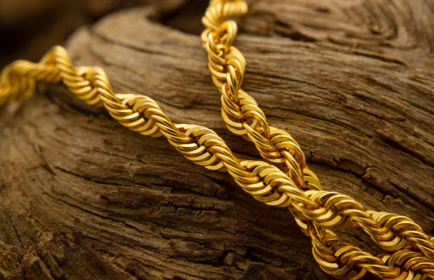 istock gold chain necklace on the tree 1292364299