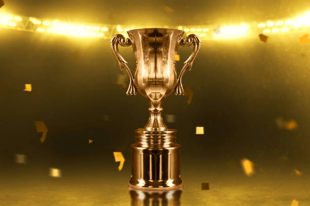 istock Champion golden trophy cup background 1292365523