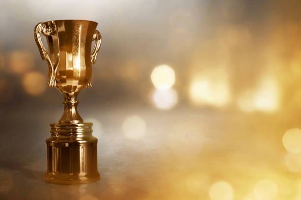 istock Champion golden trophy cup background 1292365524