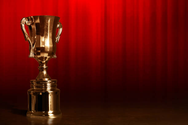 istock Champion golden trophy cup background 1292365526