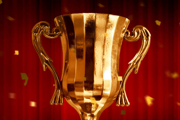 istock Champion golden trophy cup background 1292365528