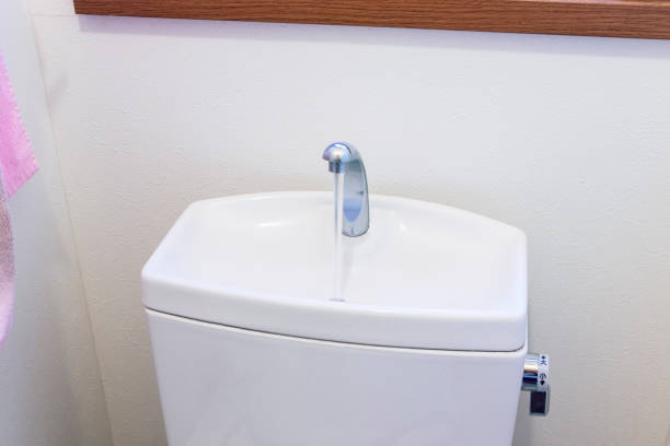 Clean white tank of flush toilet Clean white tank of flush toilet japanese toilet stock pictures, royalty-free photos & images