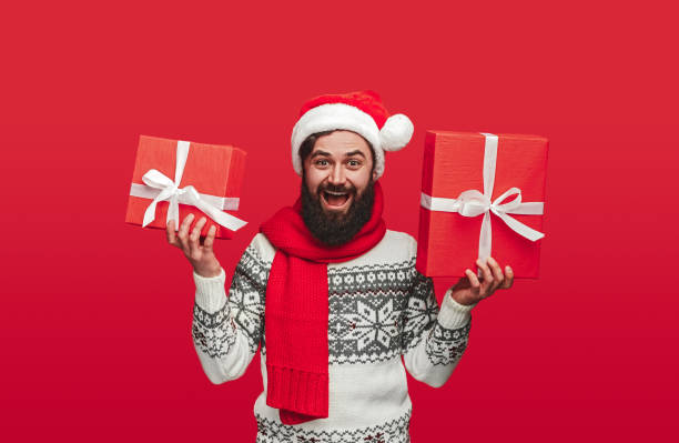 istock Excited bearded man with Christmas presents 1292366907