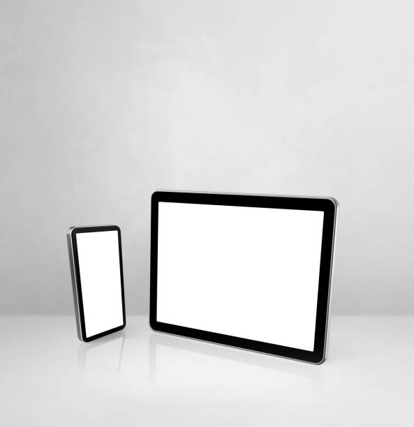 istock Mobile phone and digital tablet pc on white concrete office desk 1292366910