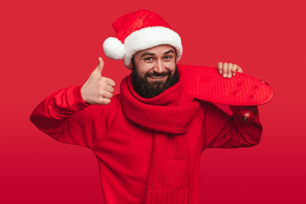 istock Delighted man with skateboard on Christmas day 1292366923