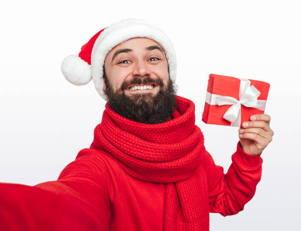 istock Happy hipster taking selfie with Christmas gift 1292366927