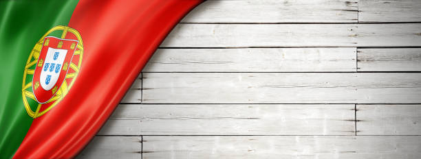 istock Portuguese flag on old white wall banner 1292367058