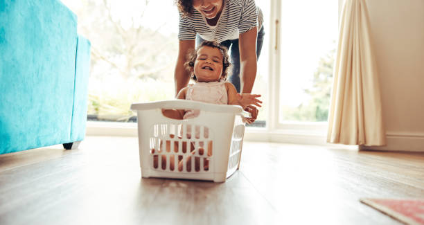 istock Cute family playing together at home 1292372051