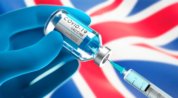 istock Medical syringe with vaccine - UK 1292372123