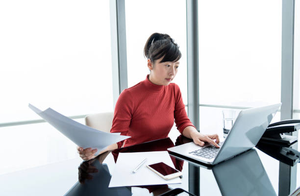 istock Woman doing paperwork in office 1292374022
