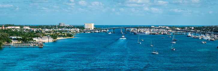 Wide image with a view of harbor and sea with a connecting bridge between Nassau and Paradise Island in the Bahamas. Summer cruise destination in the Caribbean.