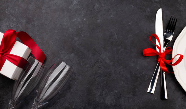 istock Valentines day with gift box, plate, champagne and silverware 1292374552