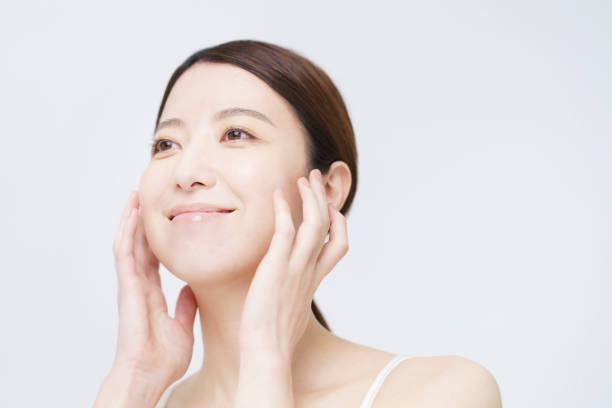 istock Asian woman touching her face 1292375350