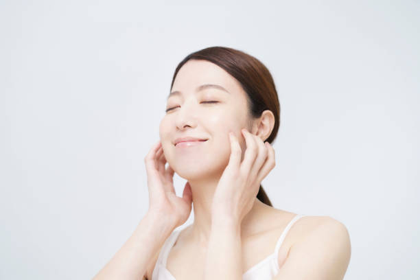 istock Asian woman touching her face 1292375466
