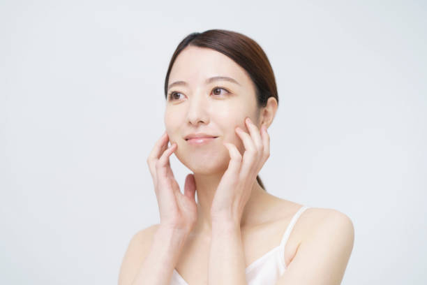 istock Asian woman touching her face 1292375608