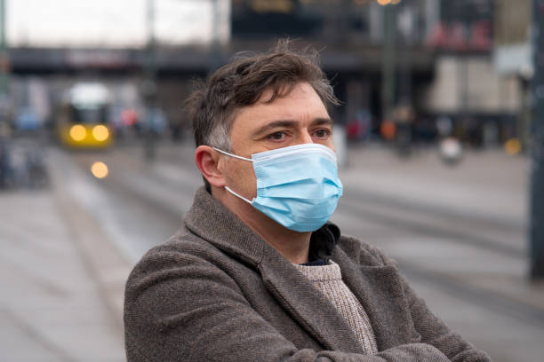 istock Wearing protective masks outdoors in the city 1292376544